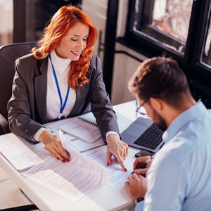 Personal injury attorney reviewing paperwork with a client in Jefferson Parish, LA, for initial consultation
